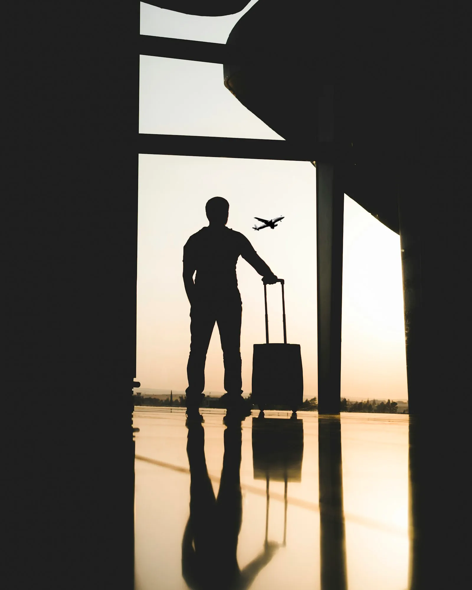 Traveler with luggage inside terminal